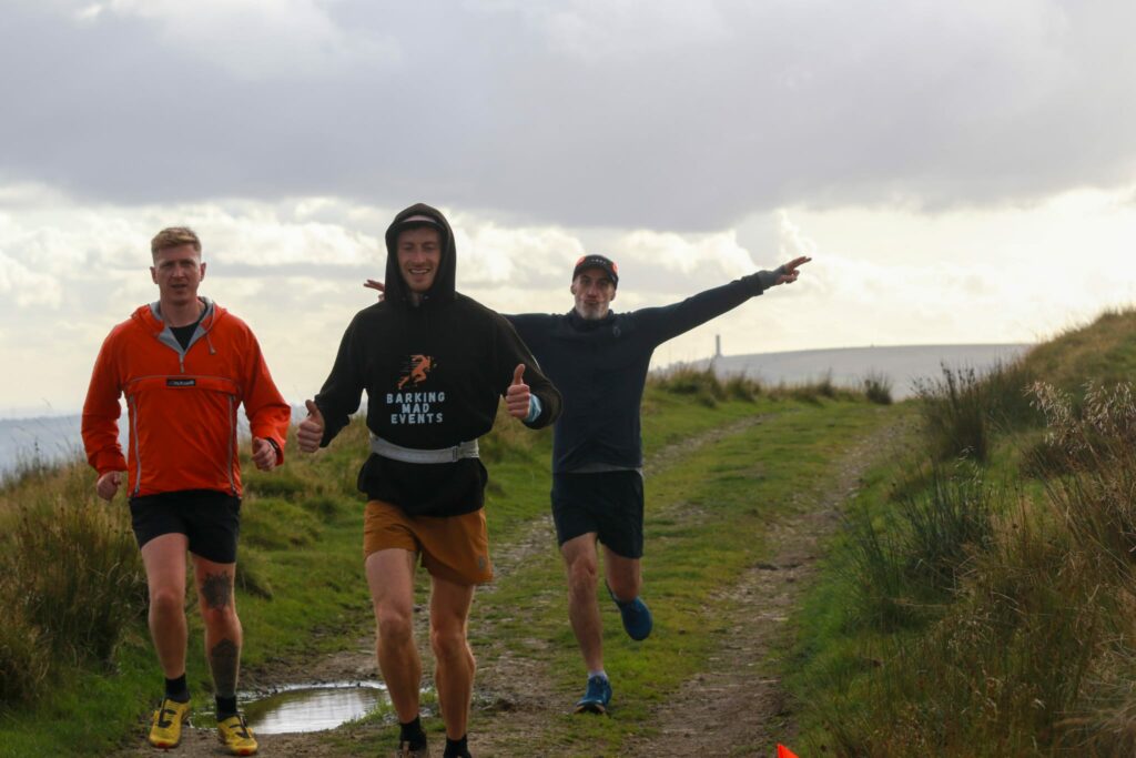 three runners participating in barking mad